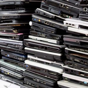 stack of laptop e-waste for recycling