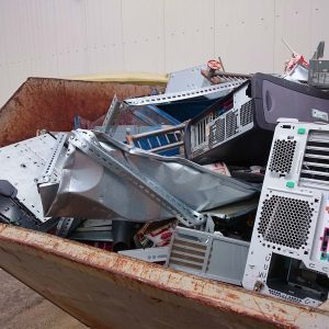 A container with computer scrap recyclables.